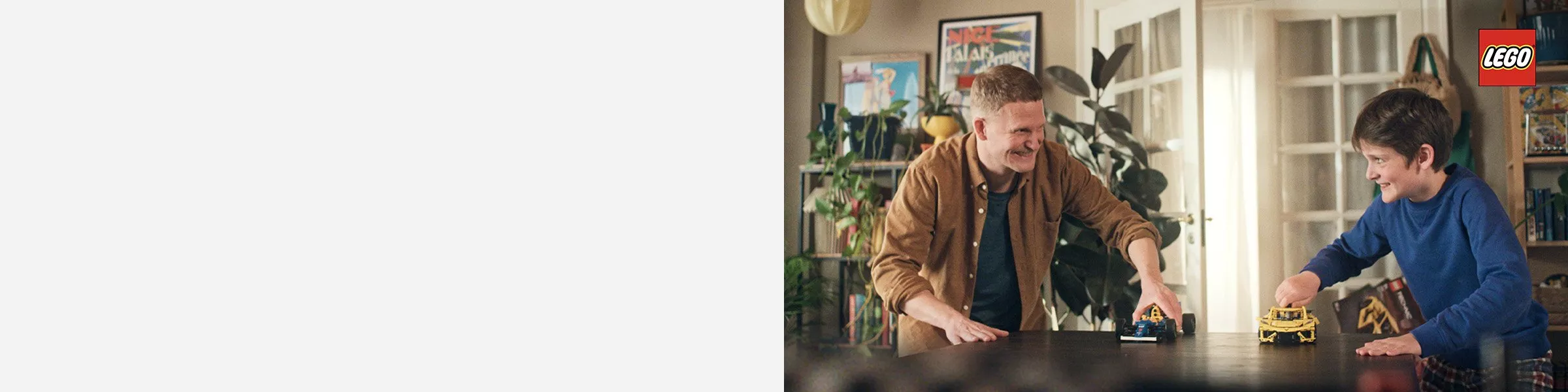 father and son playing with car lego sets