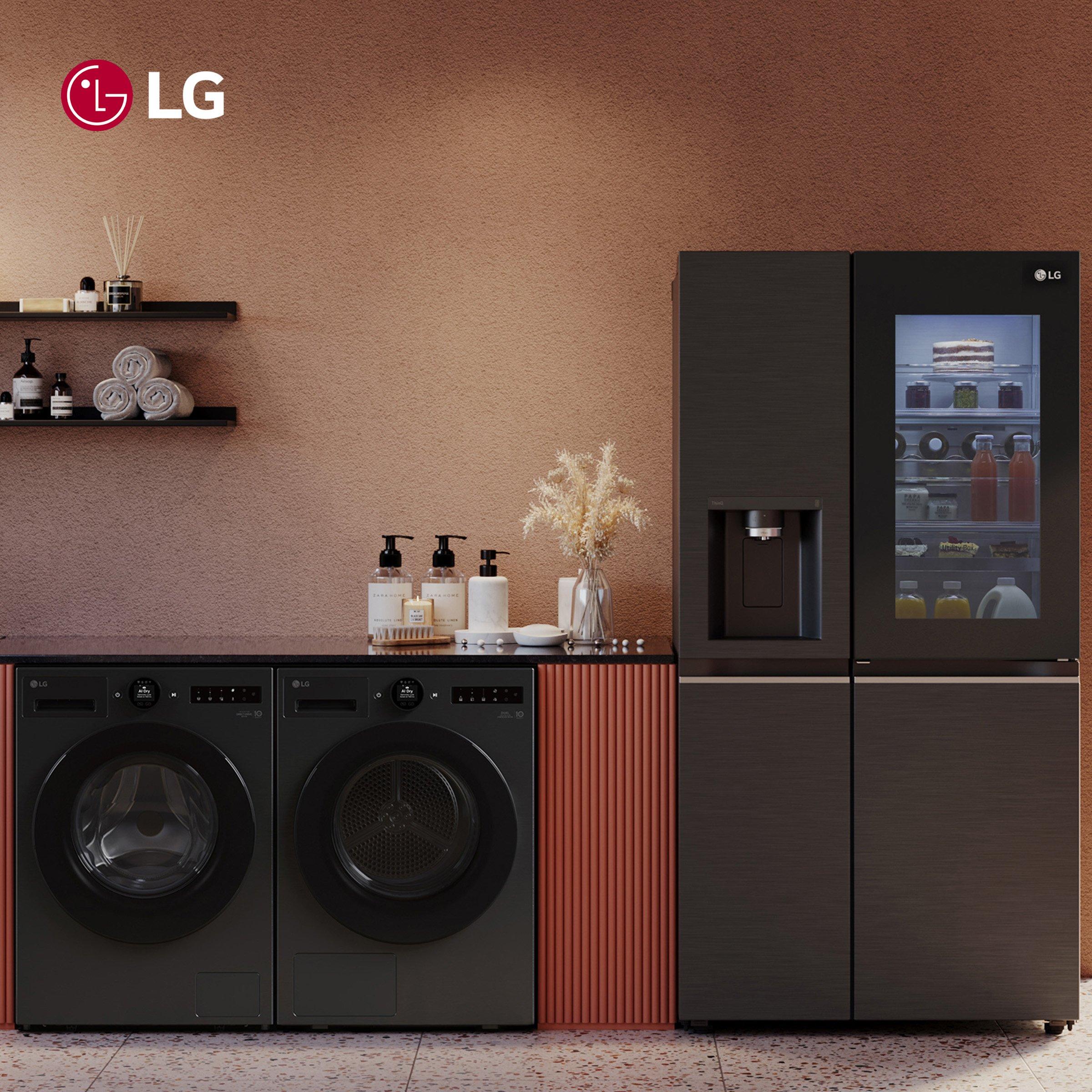 LG Black laundry appliances with a dark cabinet and lg refrigerator in a modern laundry room.