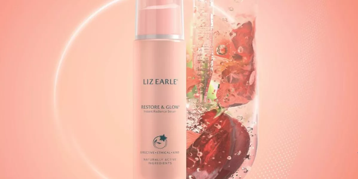 Showing the Liz Earle Restoring Glow serum on a pink background.