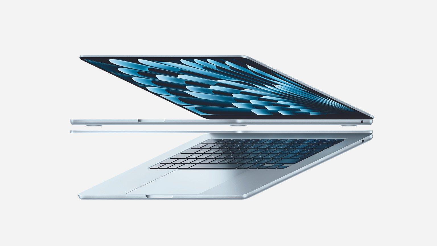 Side view of a sleek, partially open silver air MacBook with a vibrant blue display