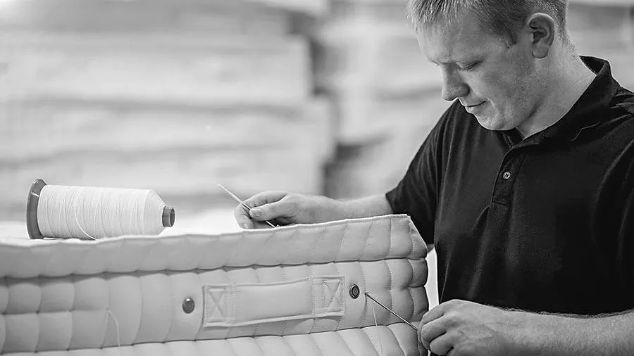 Person in a mattress factory