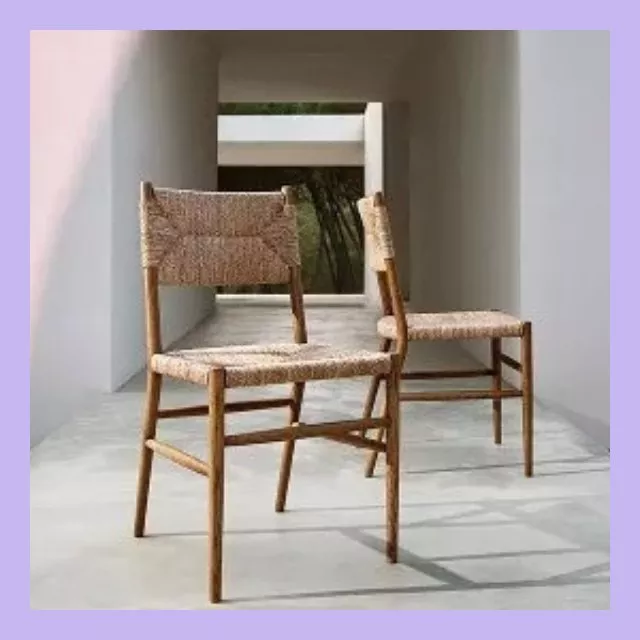 Two woven rope dining chairs with wooden frames in a minimalist modern hallway, natural light backdrop