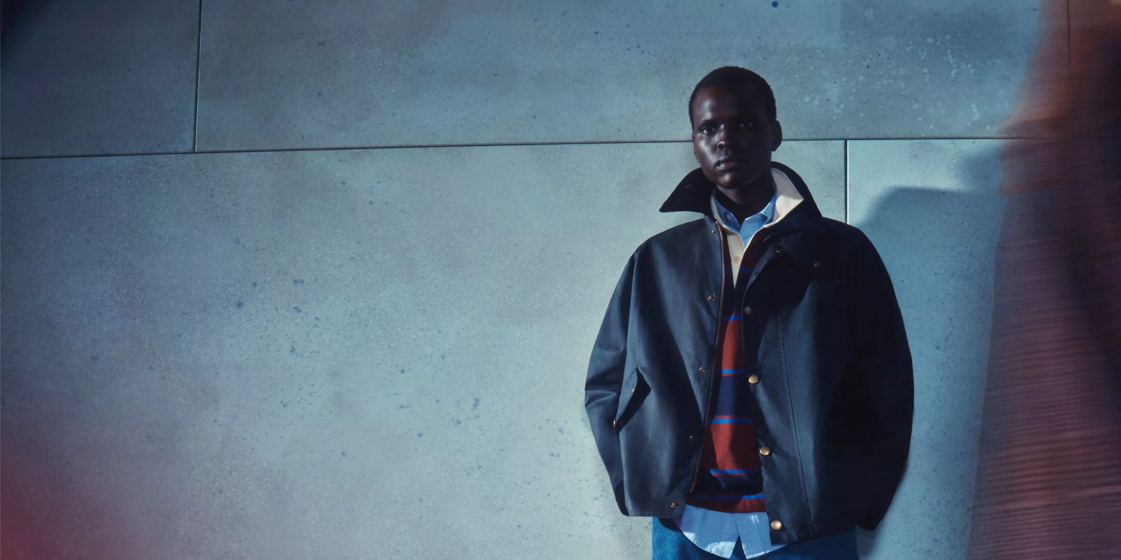 Male model wearing a navy winter jacket