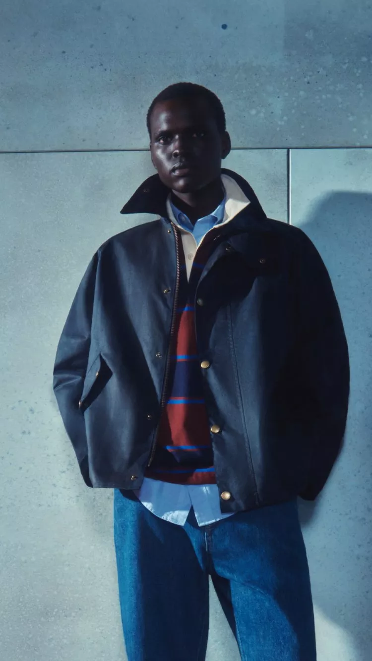Male model wearing a navy winter jacket