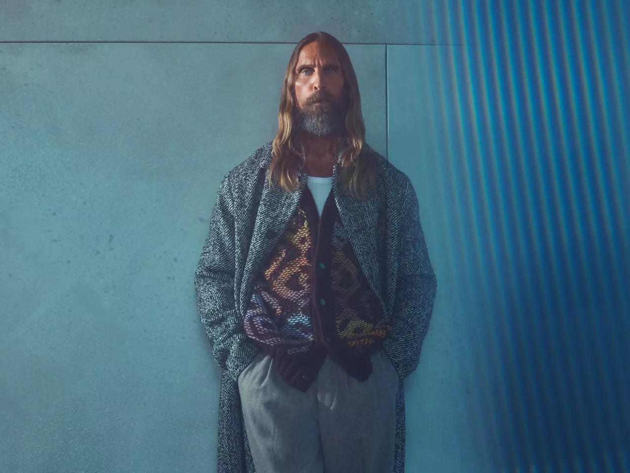 Male model wearing a long winter coat