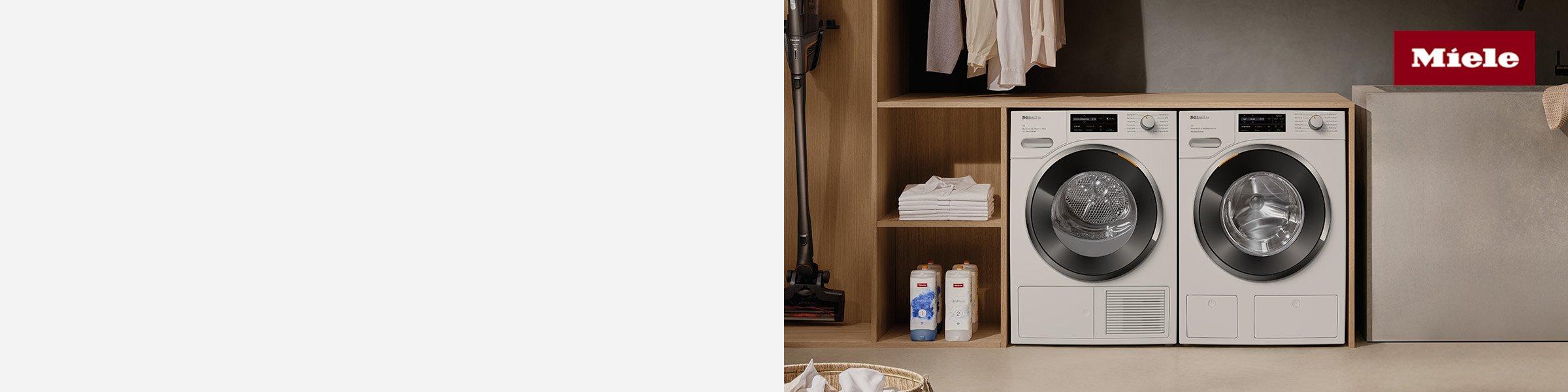 Miele laundry appliances in a modern laundry room.