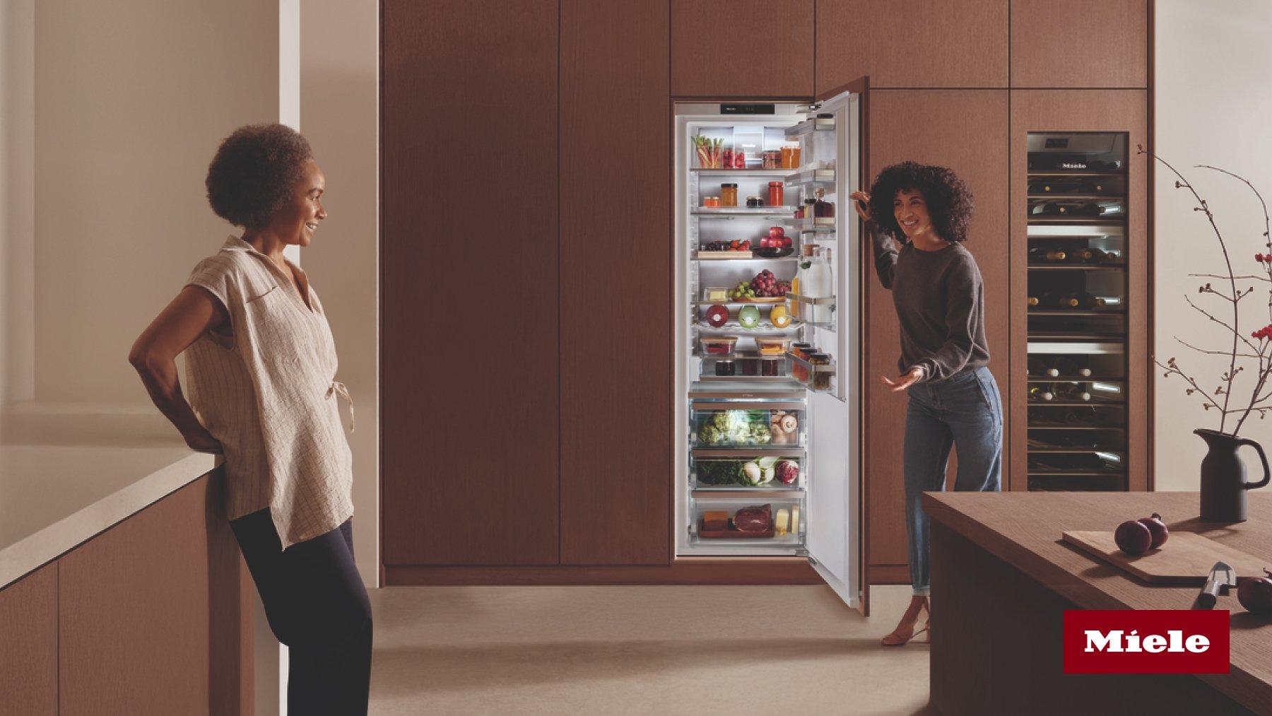Haier multi-door open refrigerator a well-organized and fully stocked with various compartments for different types of food and beverages