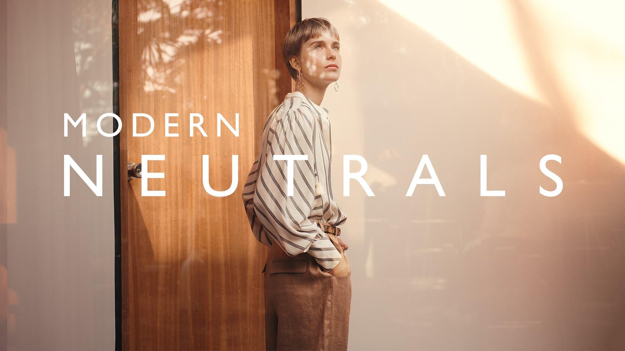 Modern Neutrals: Model in a loose striped blouse