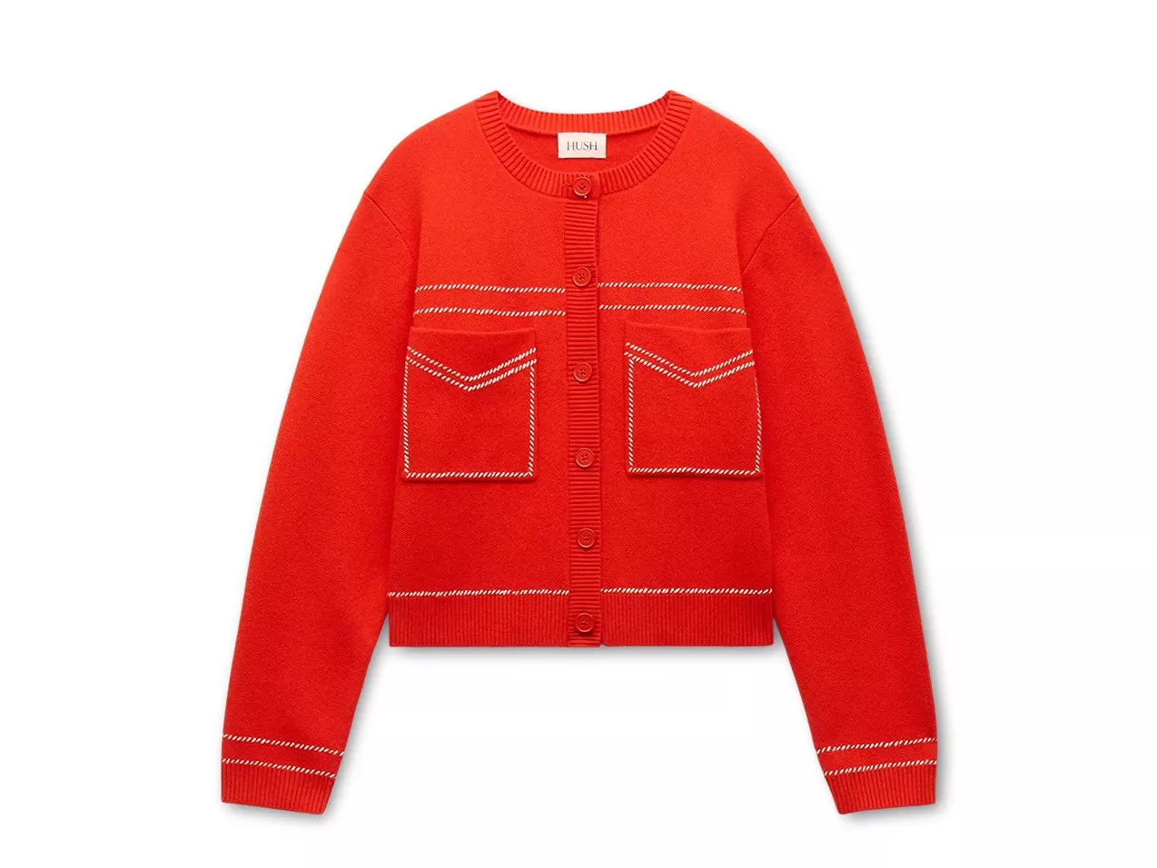 Bright red cardigan with white stitched pockets, set against multicoloured background.