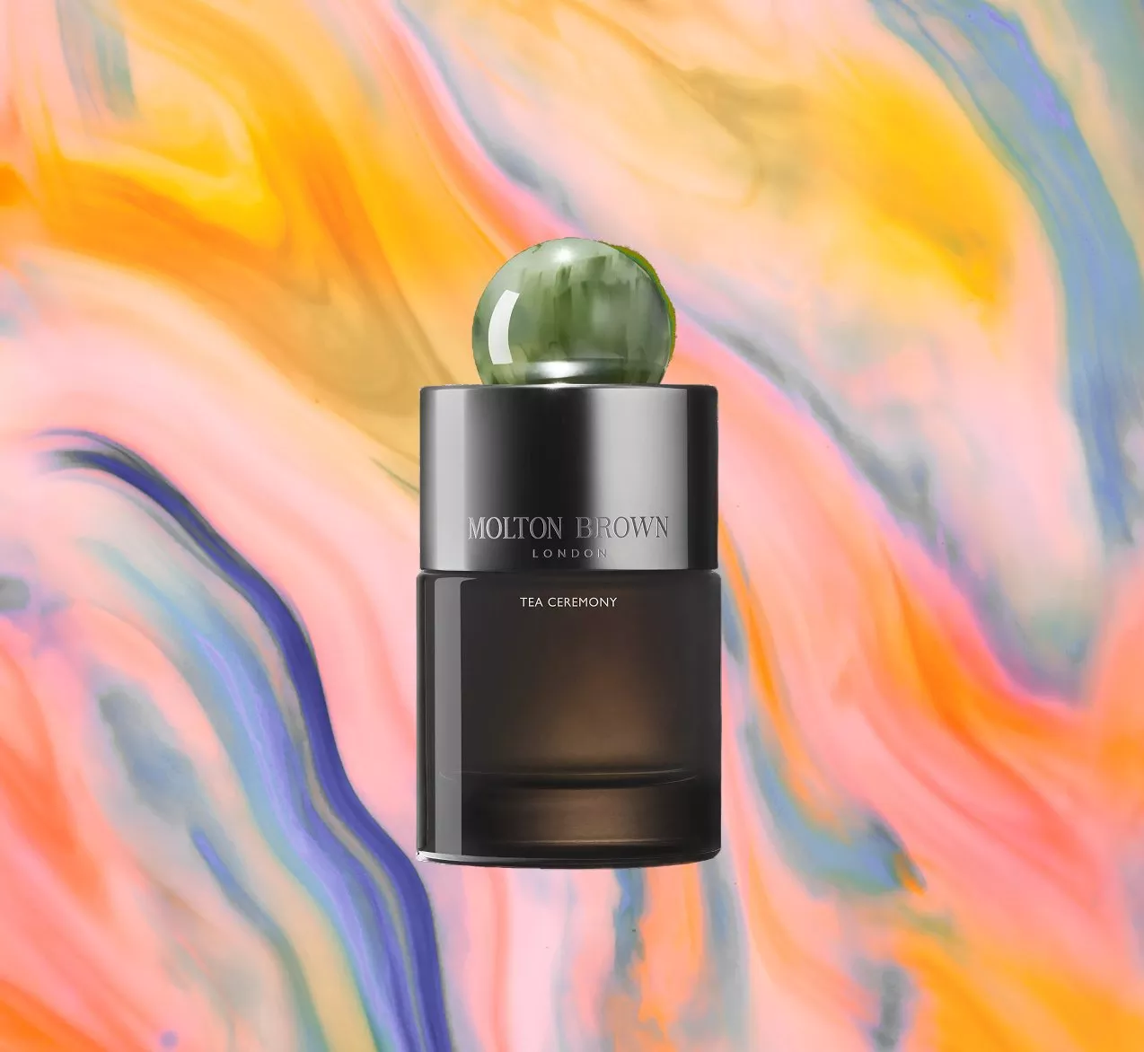 Molton Brown perfume bottle with a green cap, set against a vibrant, swirling abstract background.
