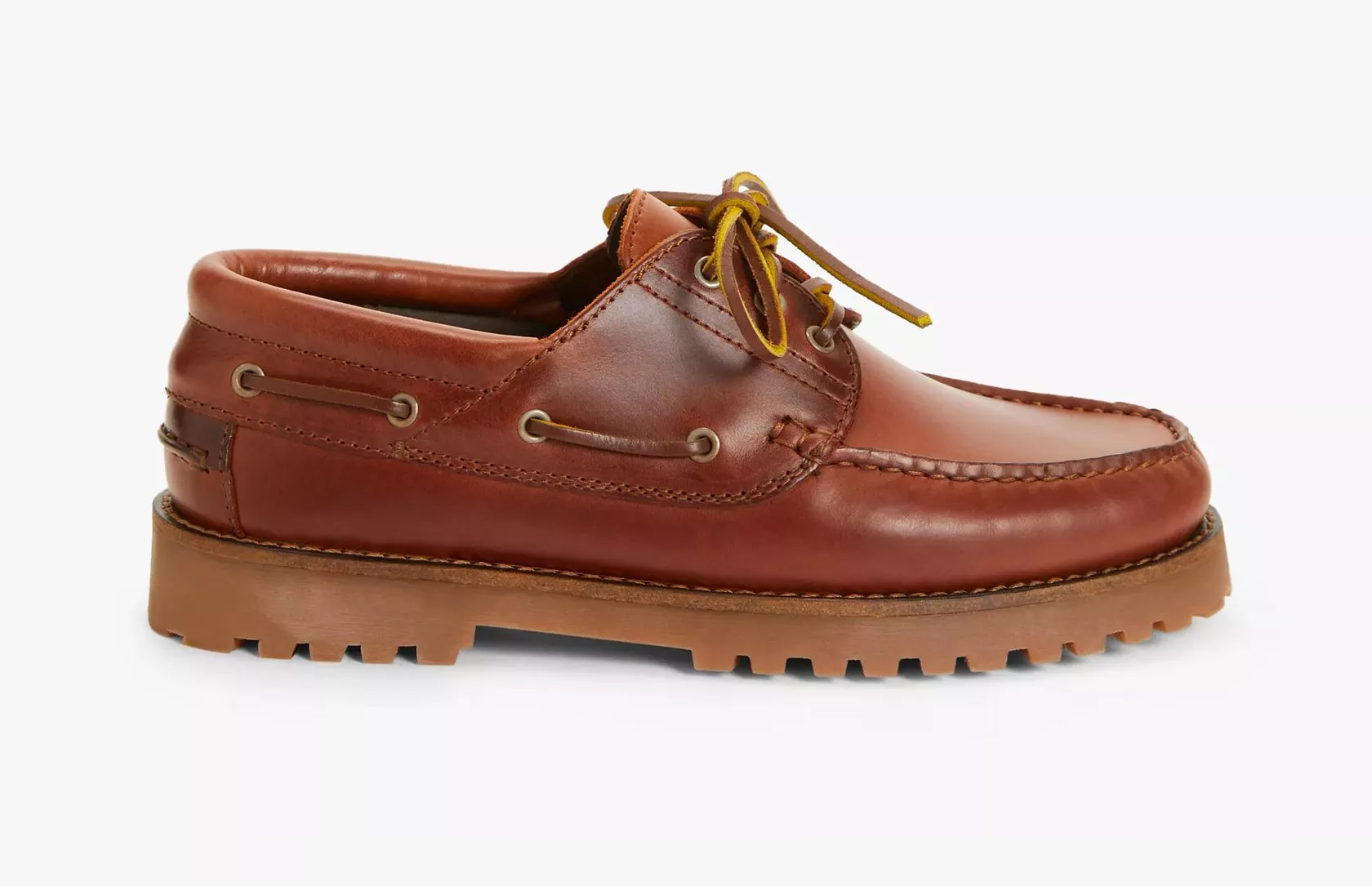 Brown leather moccasin shoe with lug sole, moc toe stitching and lace-up detail, side view on white background