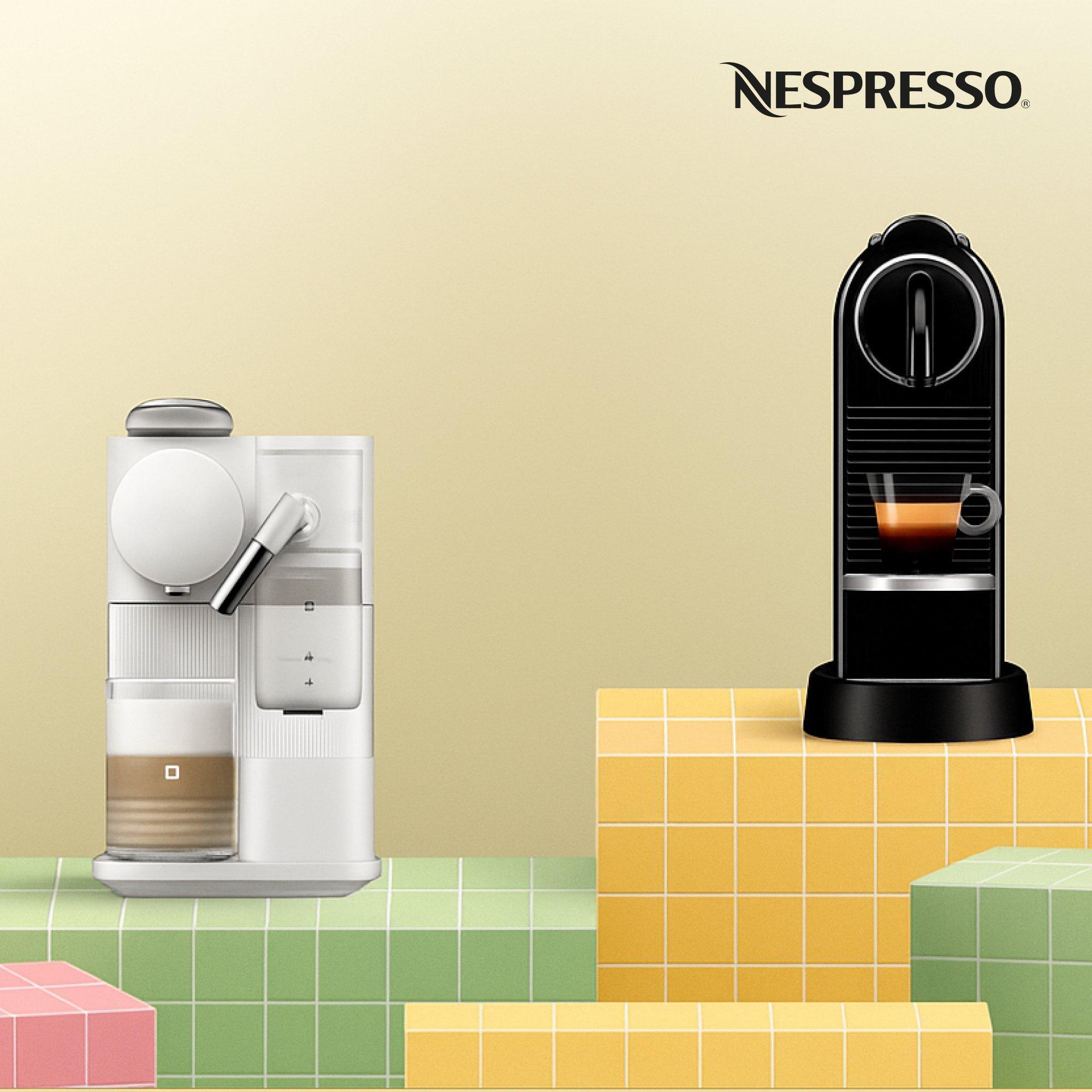 The image shows two Nespresso coffee machines placed on colorful tiled blocks.
