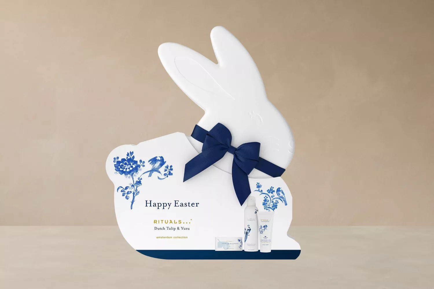 Easter gift set in bunny shape with blue floral design, featuring Dutch Tulip & Yuzu products from Rituals.