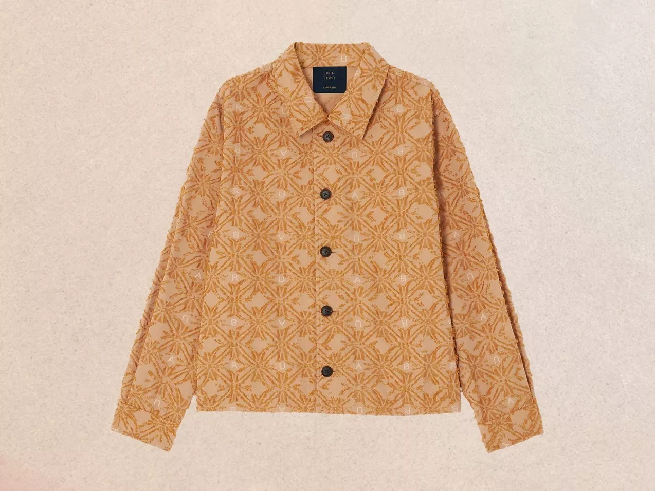 Tan button-up shirt with a textured geometric pattern and collar, featuring long sleeves.