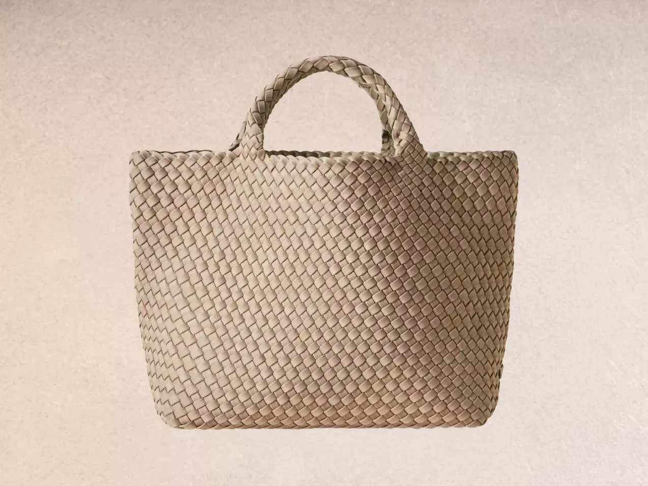 A beige woven tote bag.