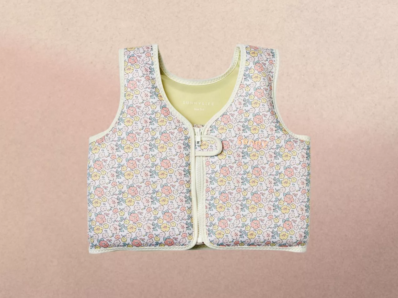Floral-patterned children's zip up swim vest.