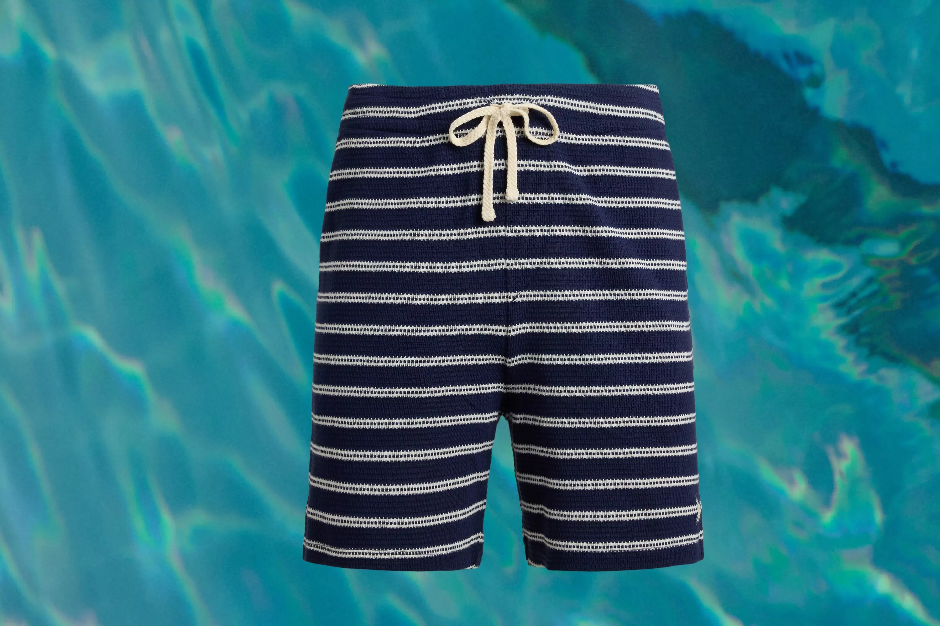 Ralph Lauren Striped Pointelle Jersey Shorts cut out on a swimming pool background