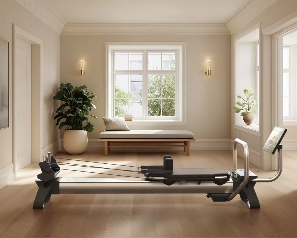 Modern home gym Pilates reformer in bright beige room with bay window, bench seating and indoor plants
