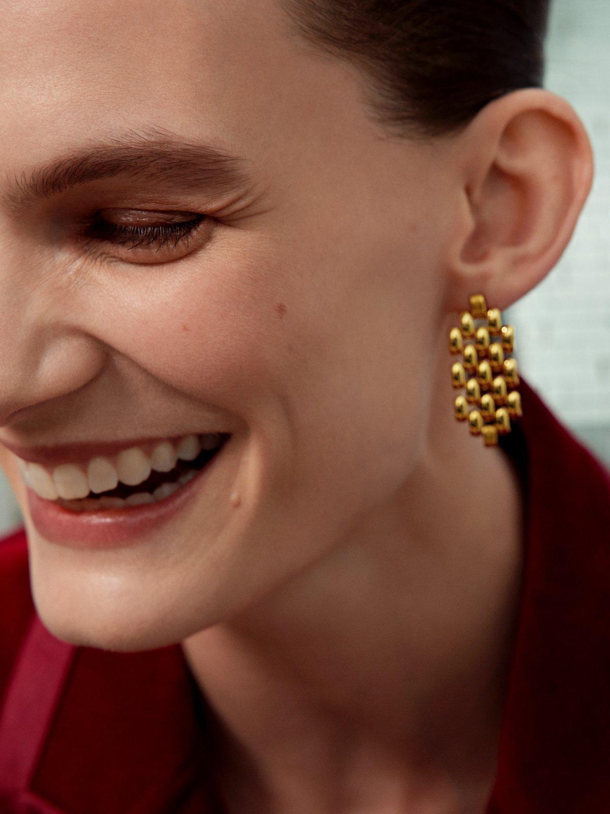 Close up image of a lady wearing an earring