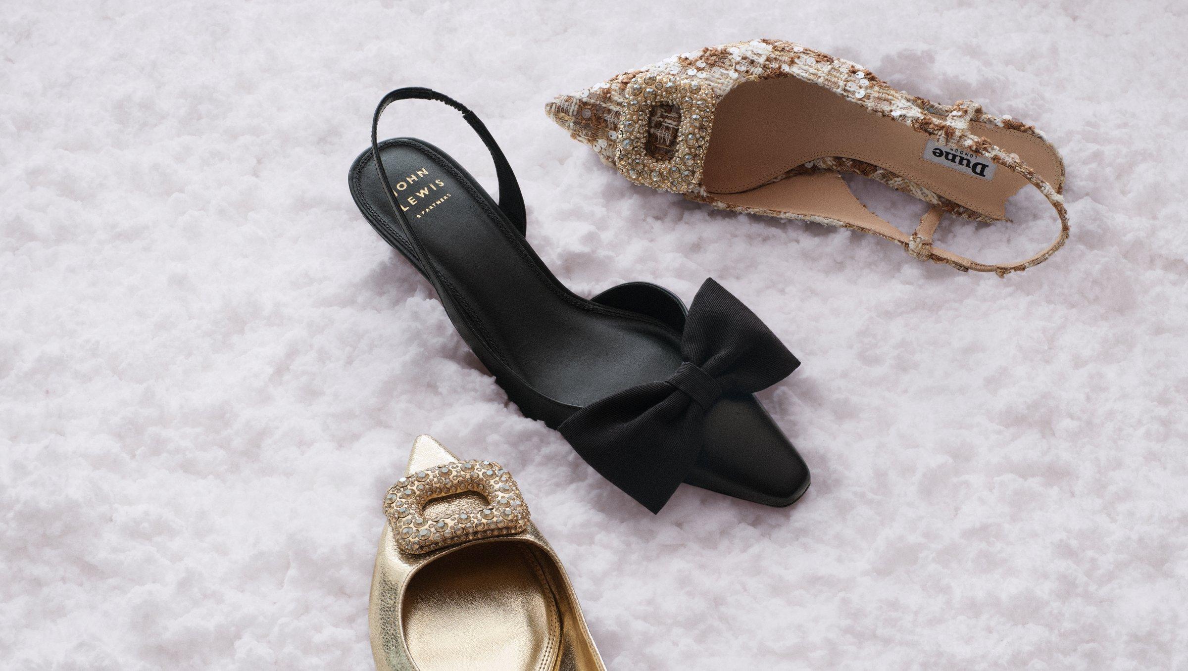 Image of 3 shoes in the snow