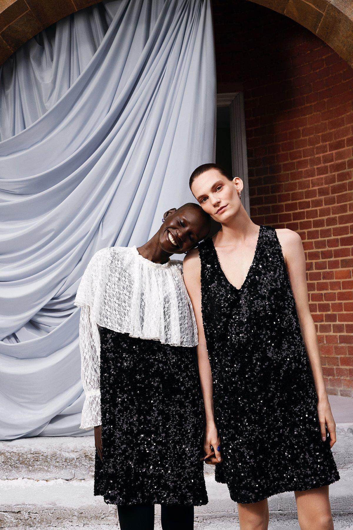 Two women standing side by side