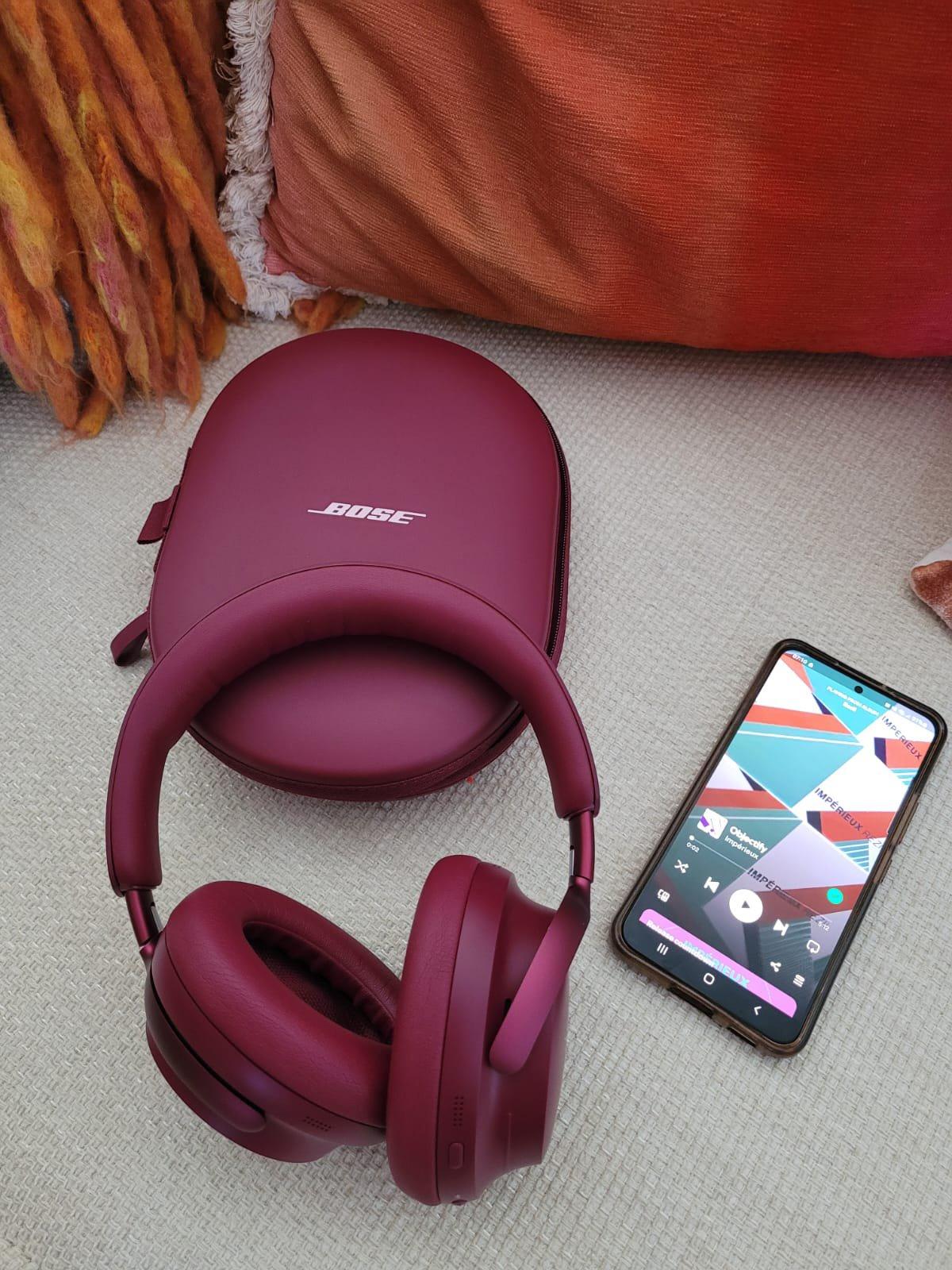 Bose QuietComfort Ultra Headphones next to mobile phone