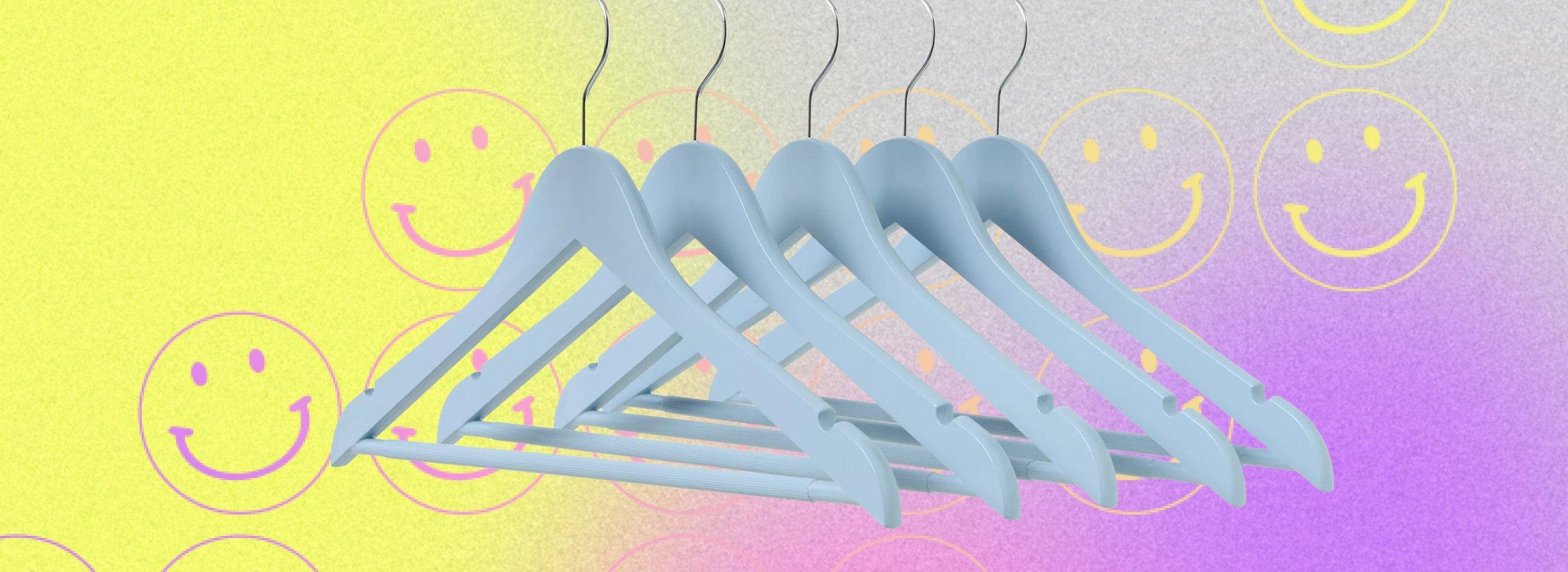 cutout of a hangers on a multicolour bacground with smiley faces on it