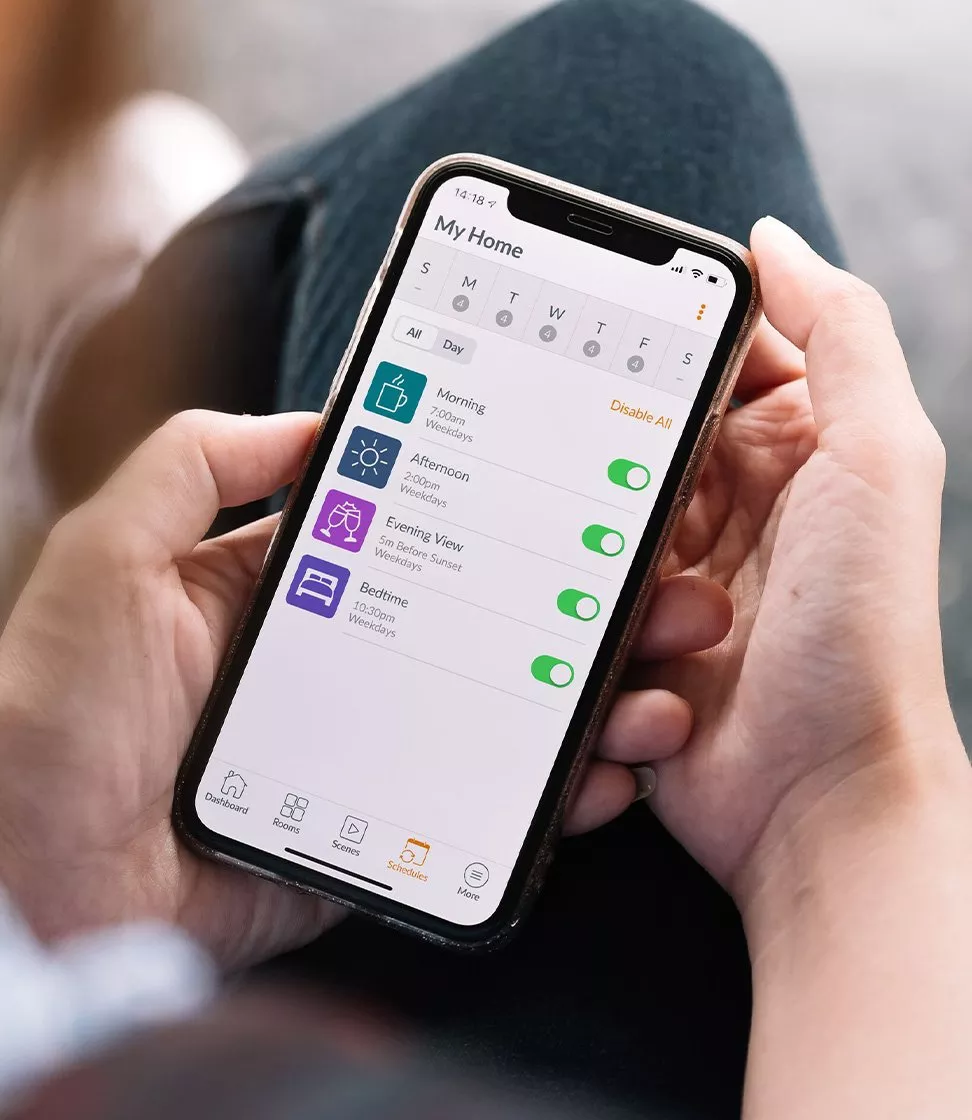 Person holding a phone with a scheduling app on the screen