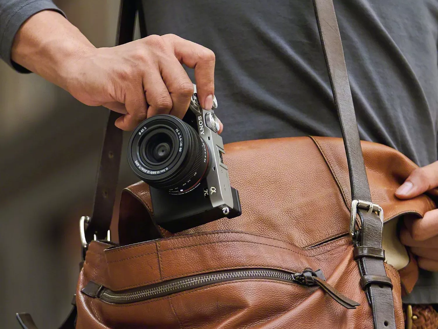  person taking camera out of bag