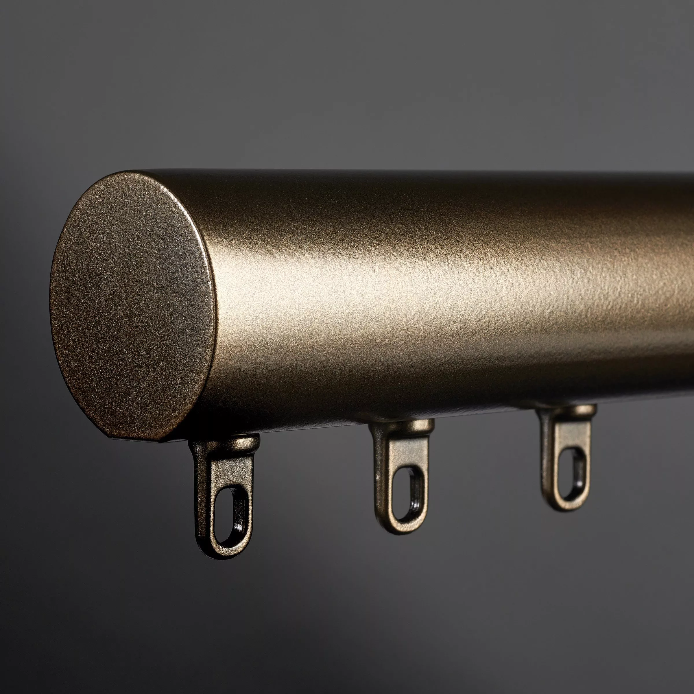 Bronze curtain pole with eyelet fastenings