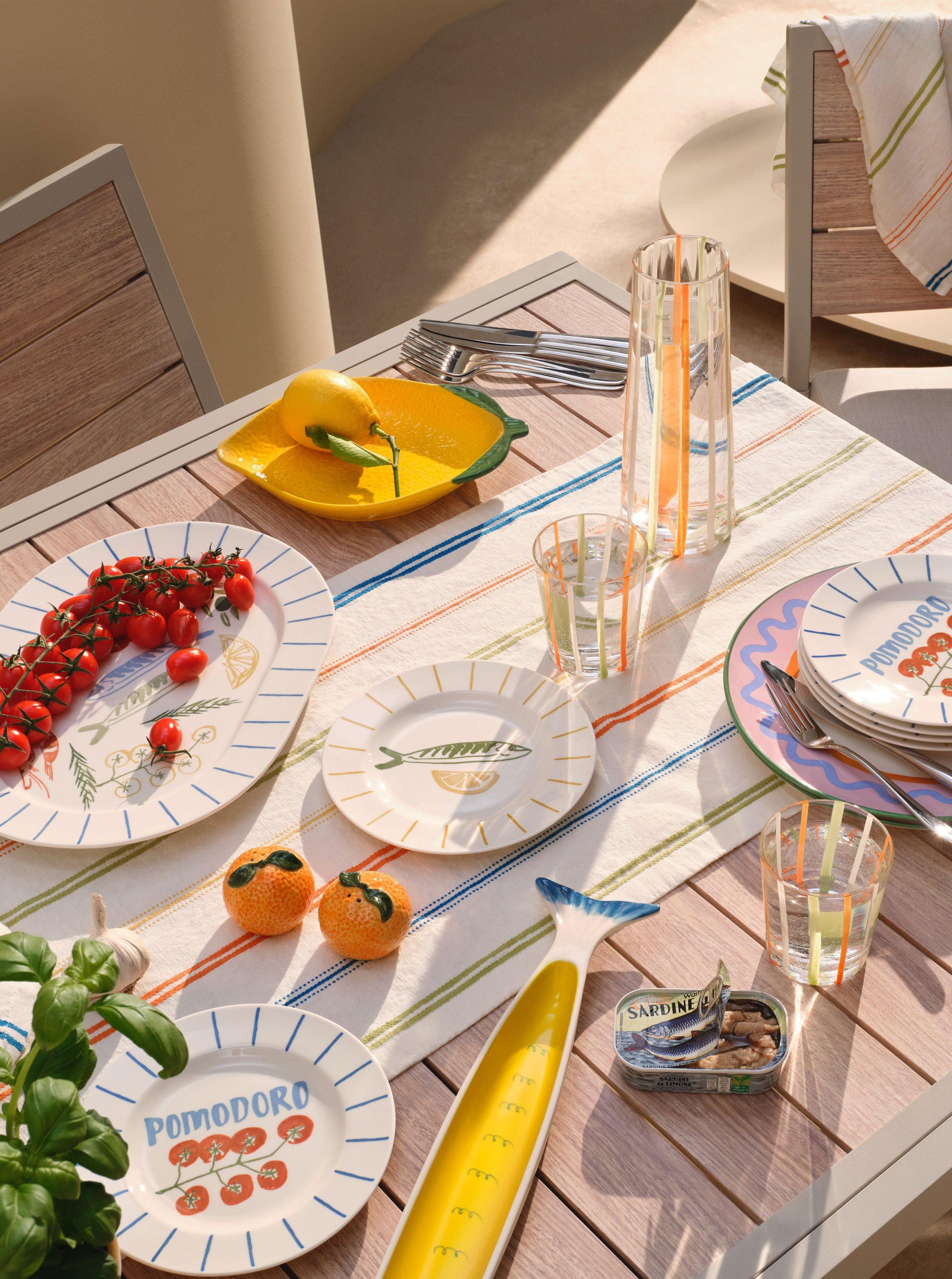 various shaped plates on a dressed outdoor table