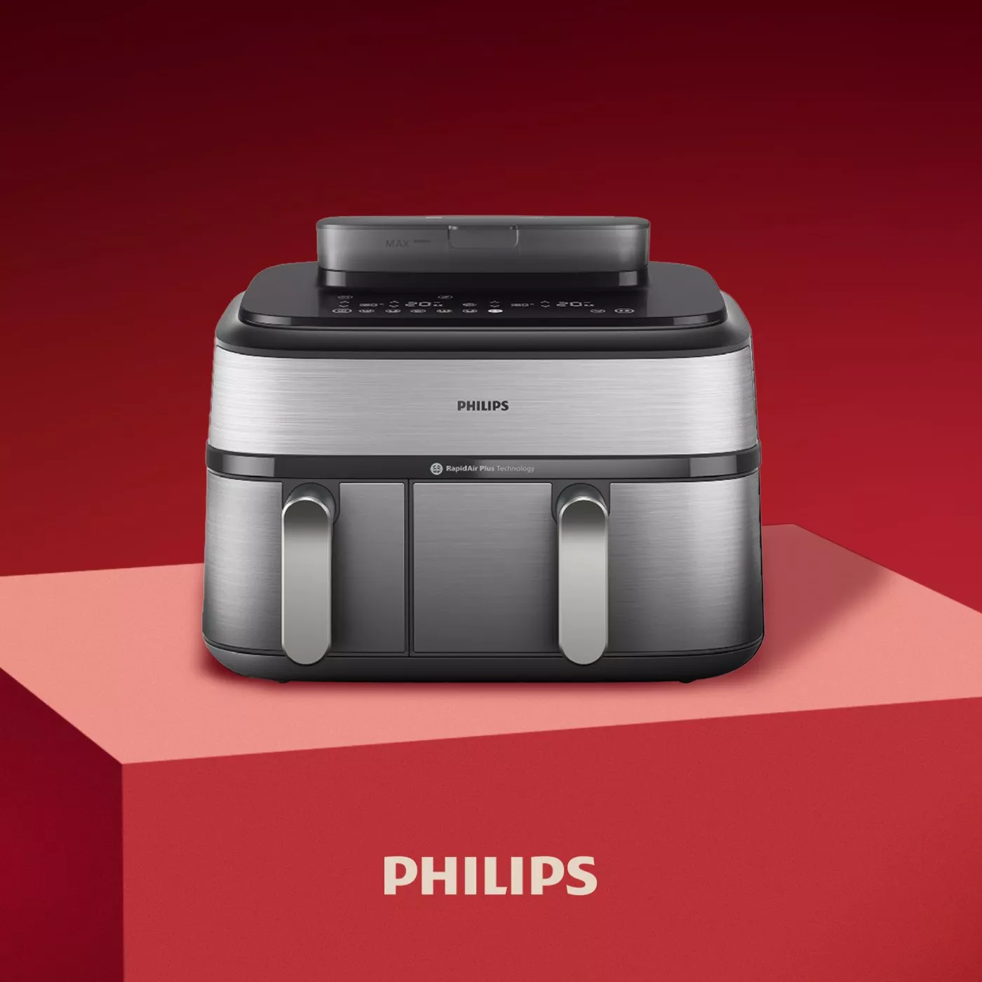 Philips dual basket air fryer in brushed stainless steel on red podium, modern kitchen appliance product photo