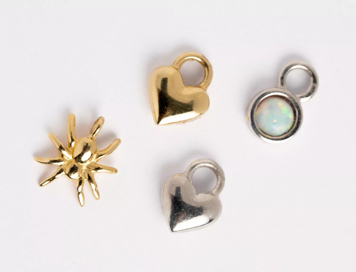 selection of charms in silver and gold