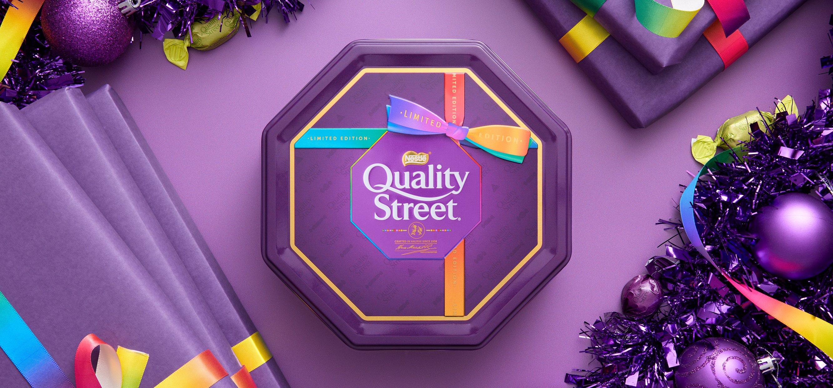 Quality Street chocolates among fairy lights
