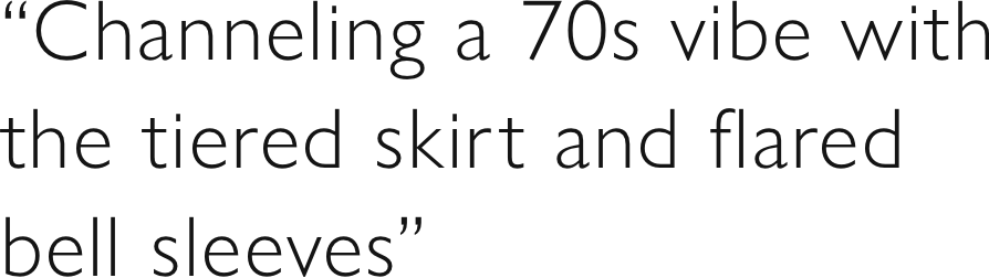 “Channeling a 70s vibe with the tiered skirt and flared bell sleeves”