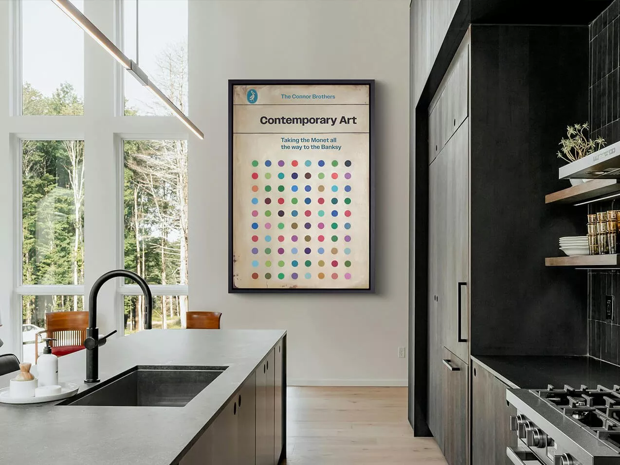 Modern kitchen interior with framed contemporary art print above dining area, large windows and dark cabinetry.