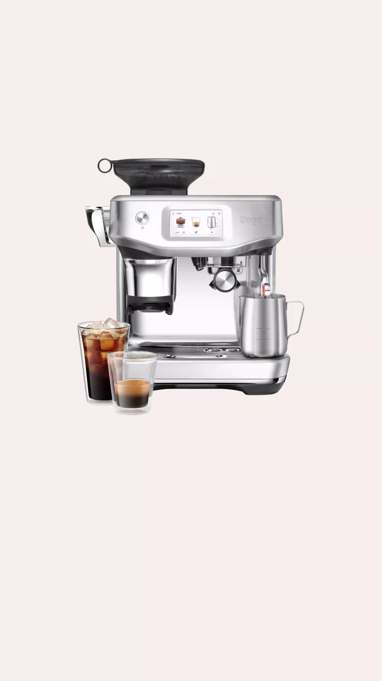 Stainless steel Sage espresso machine with built-in grinder, touchscreen and milk frothing jug on pale background