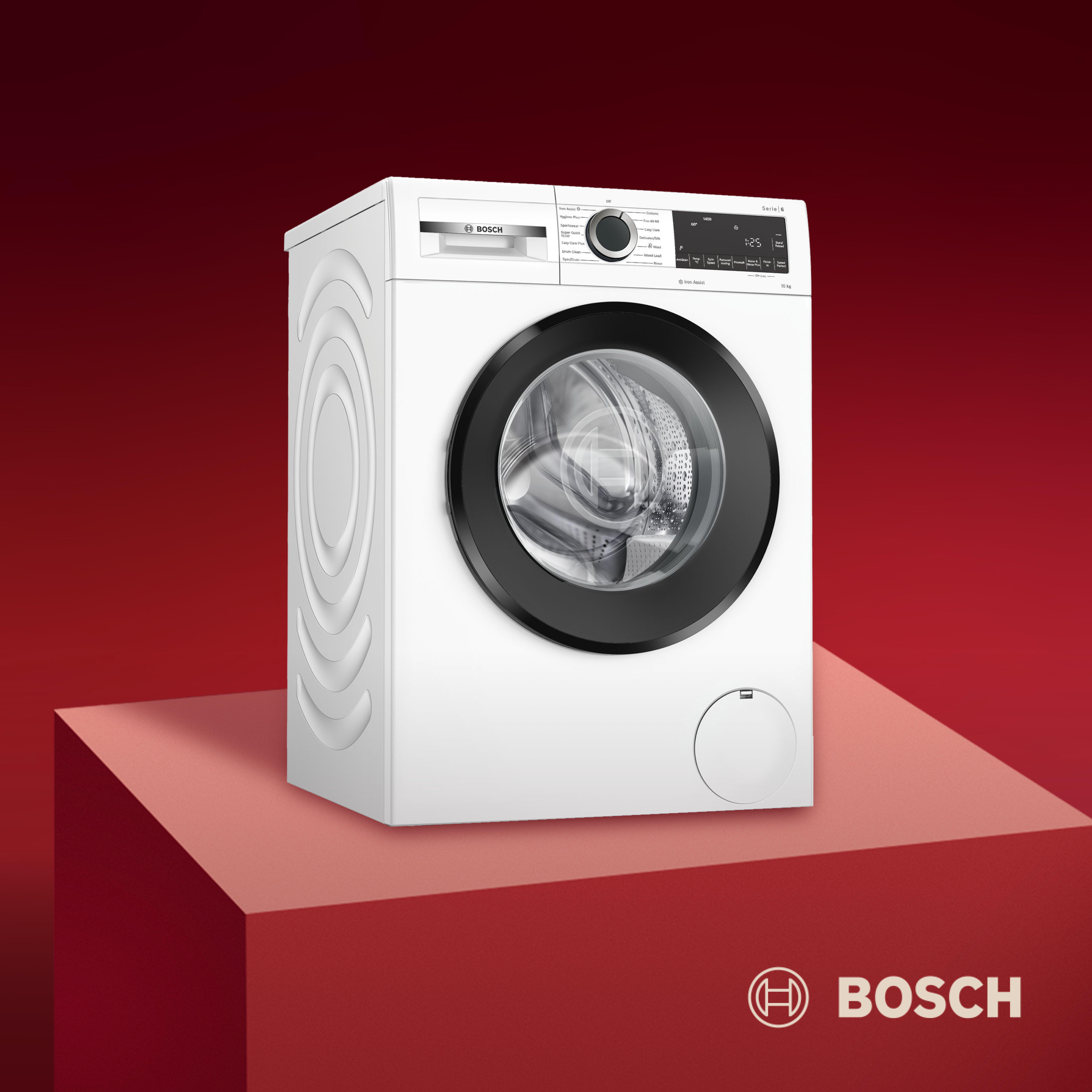 bosch waching machine on a red backbround and plinth