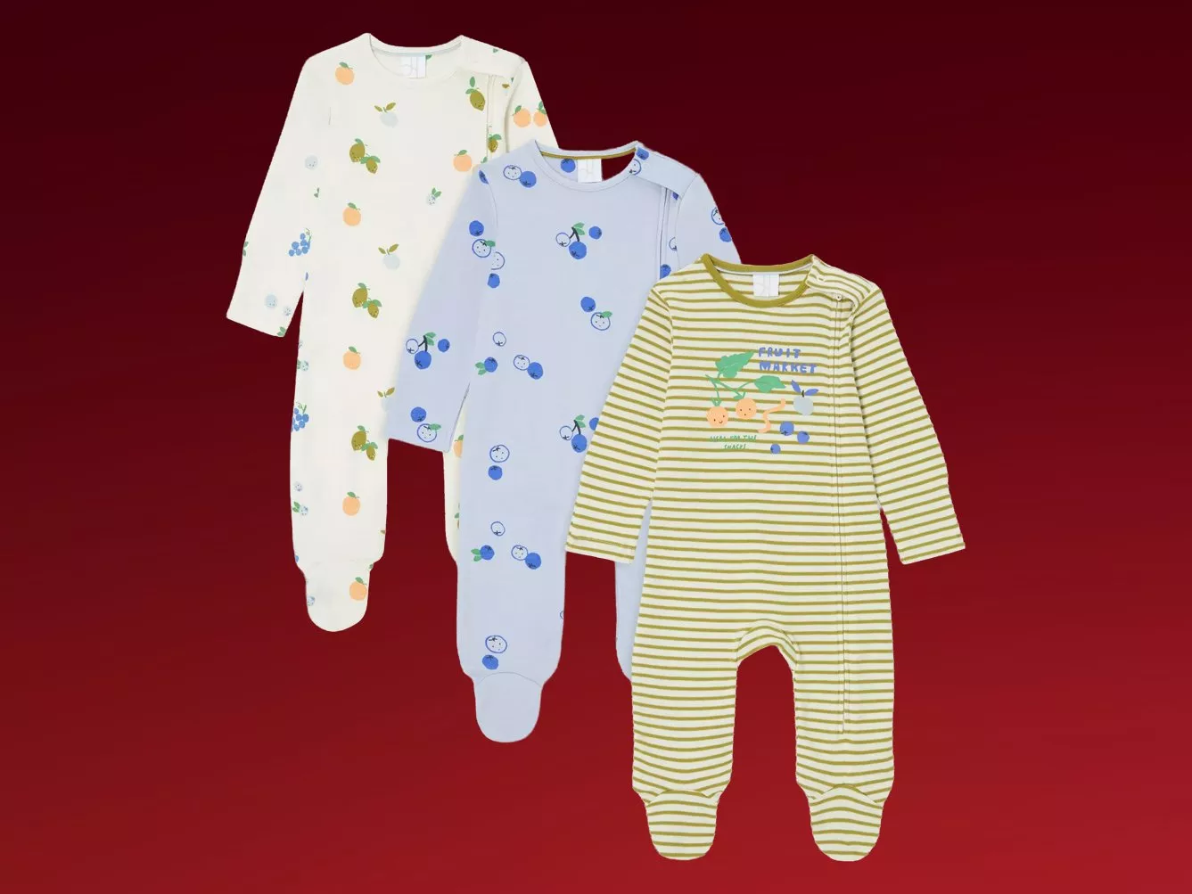 Three baby sleepsuits with fruit prints, long sleeves and enclosed feet, cream, blue and striped green.