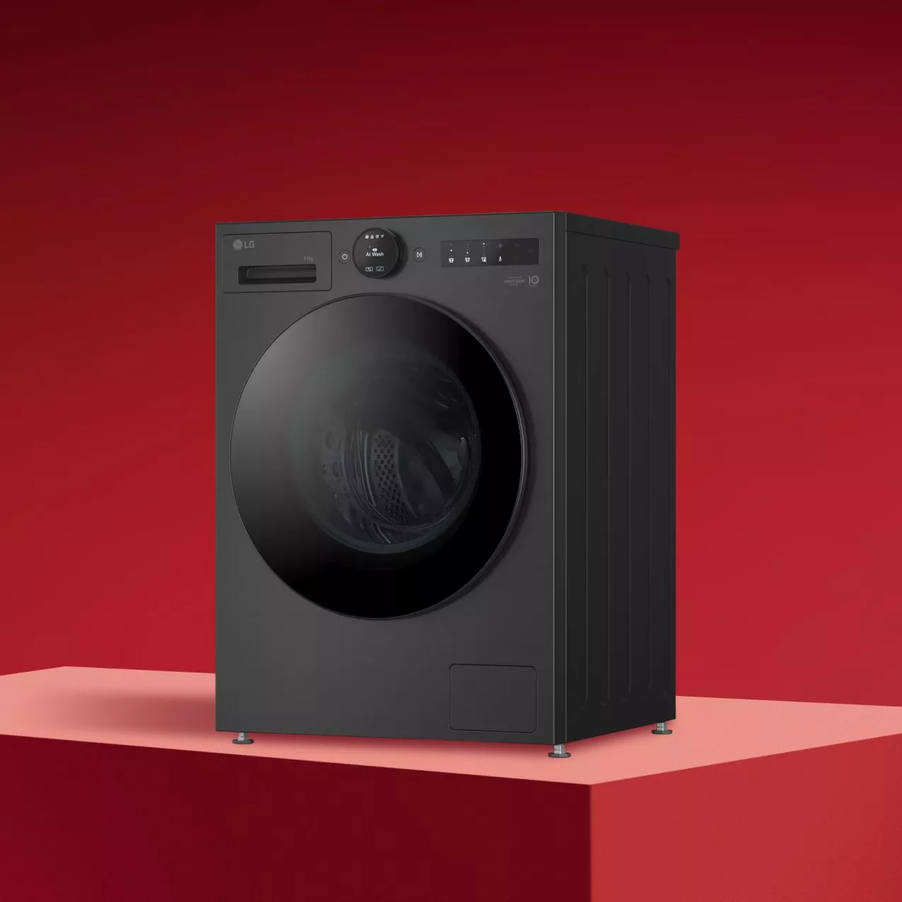 Black washing machine on a red background