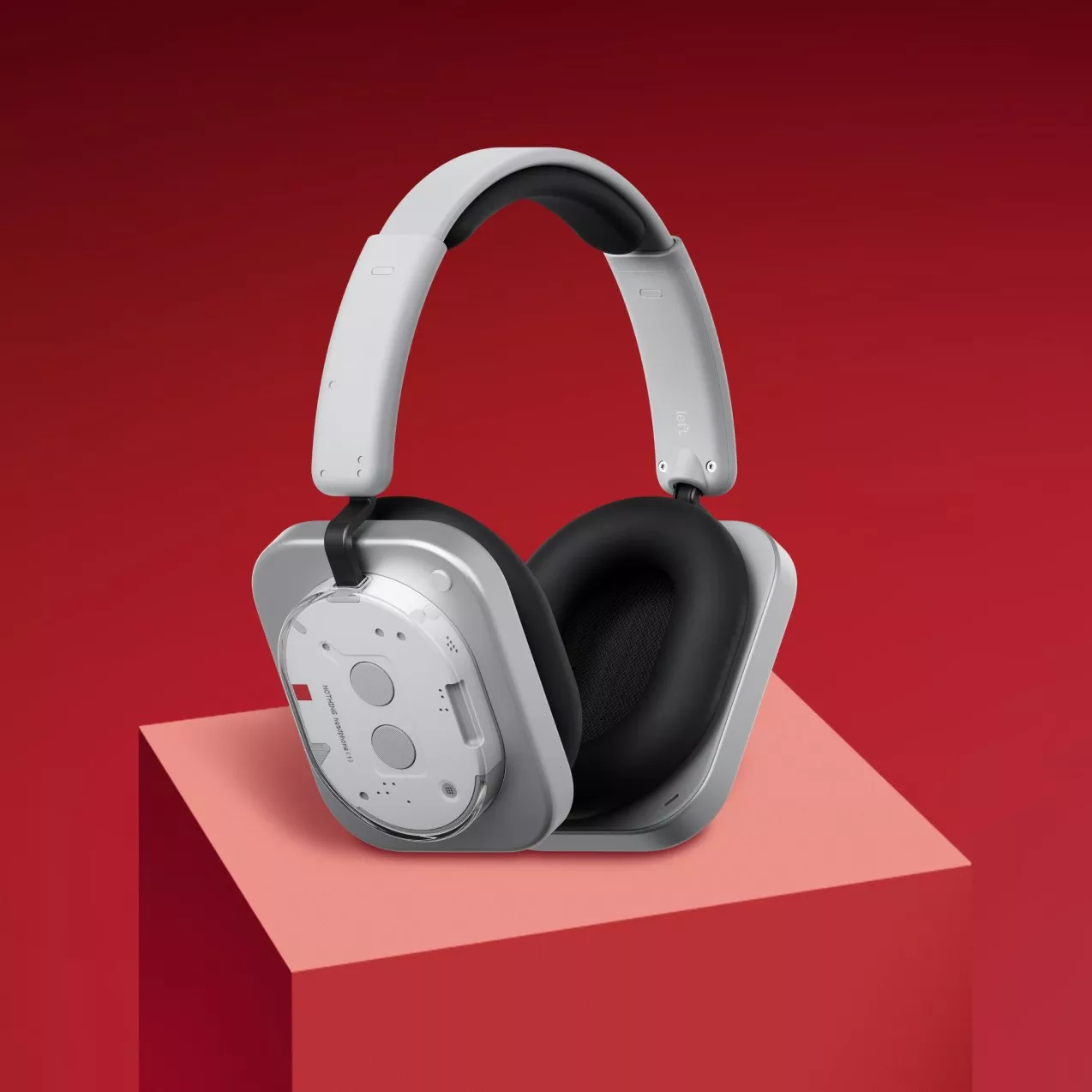 Grey headphones on a red backhrould