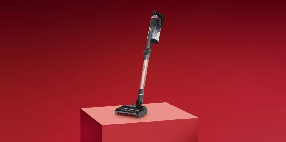 Vacuum cleaner on a red background