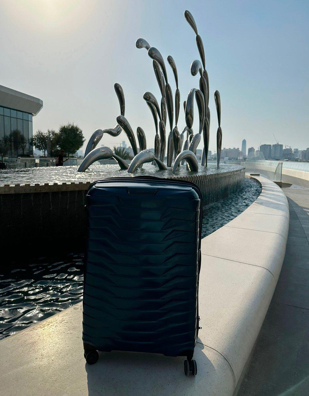 Image of a Samsonite suitcase on a fountain in Dubai