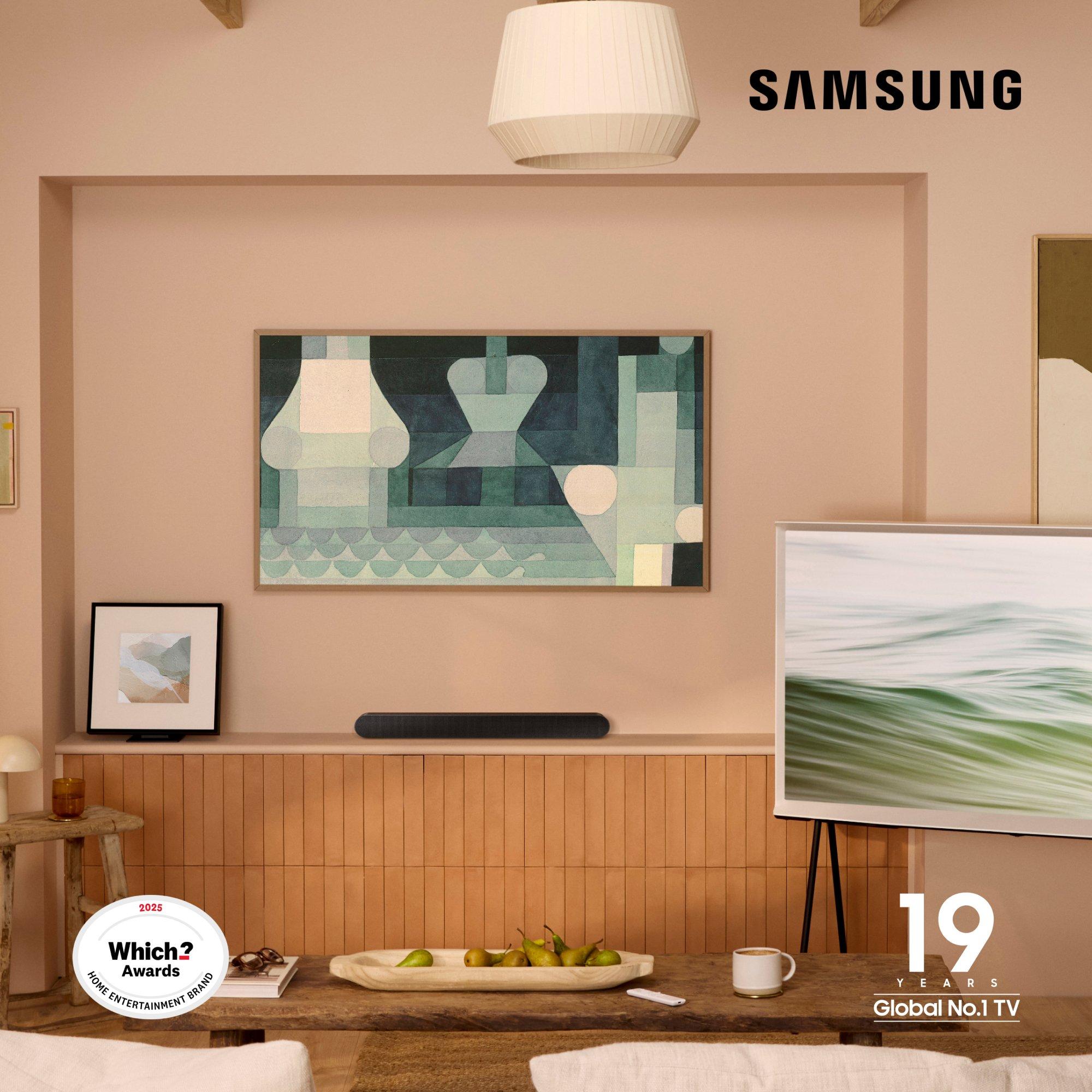 Samsung TV displayed in Art Mode with abstract artwork, wall-mounted above a soundbar; “19 Years Global No.1 TV” and “Which? Awards 2025” logos are visible.
