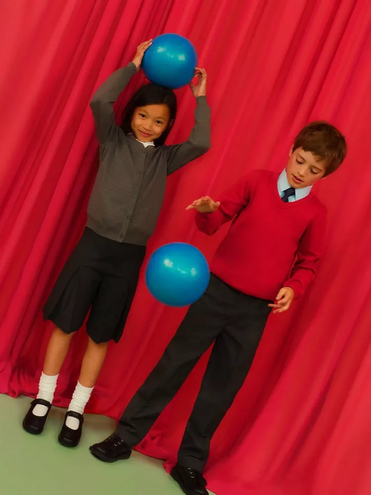 Girl and boy wearing school uniform
