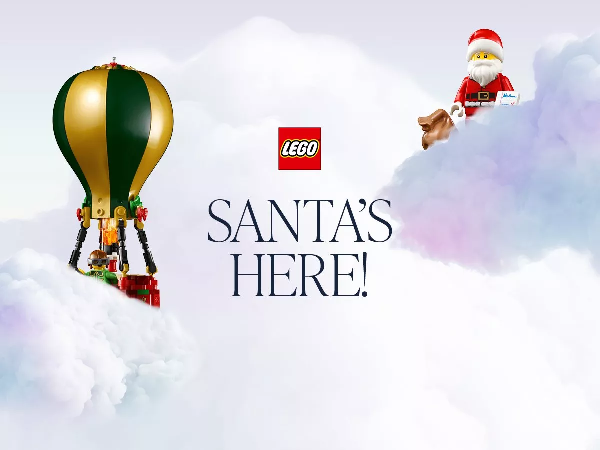 Lego Santa and Elf toys floating within clouds. SANTA'S HERE!