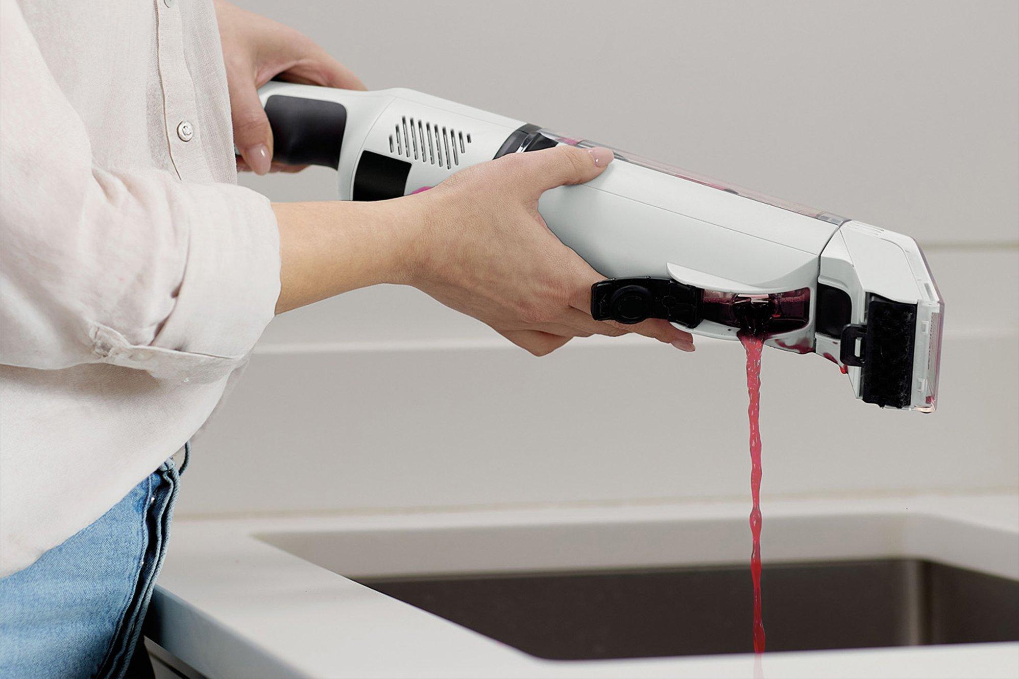 Shark StainForce Cordless Stain-Destroying Spot Cleaner being emptied in a sink