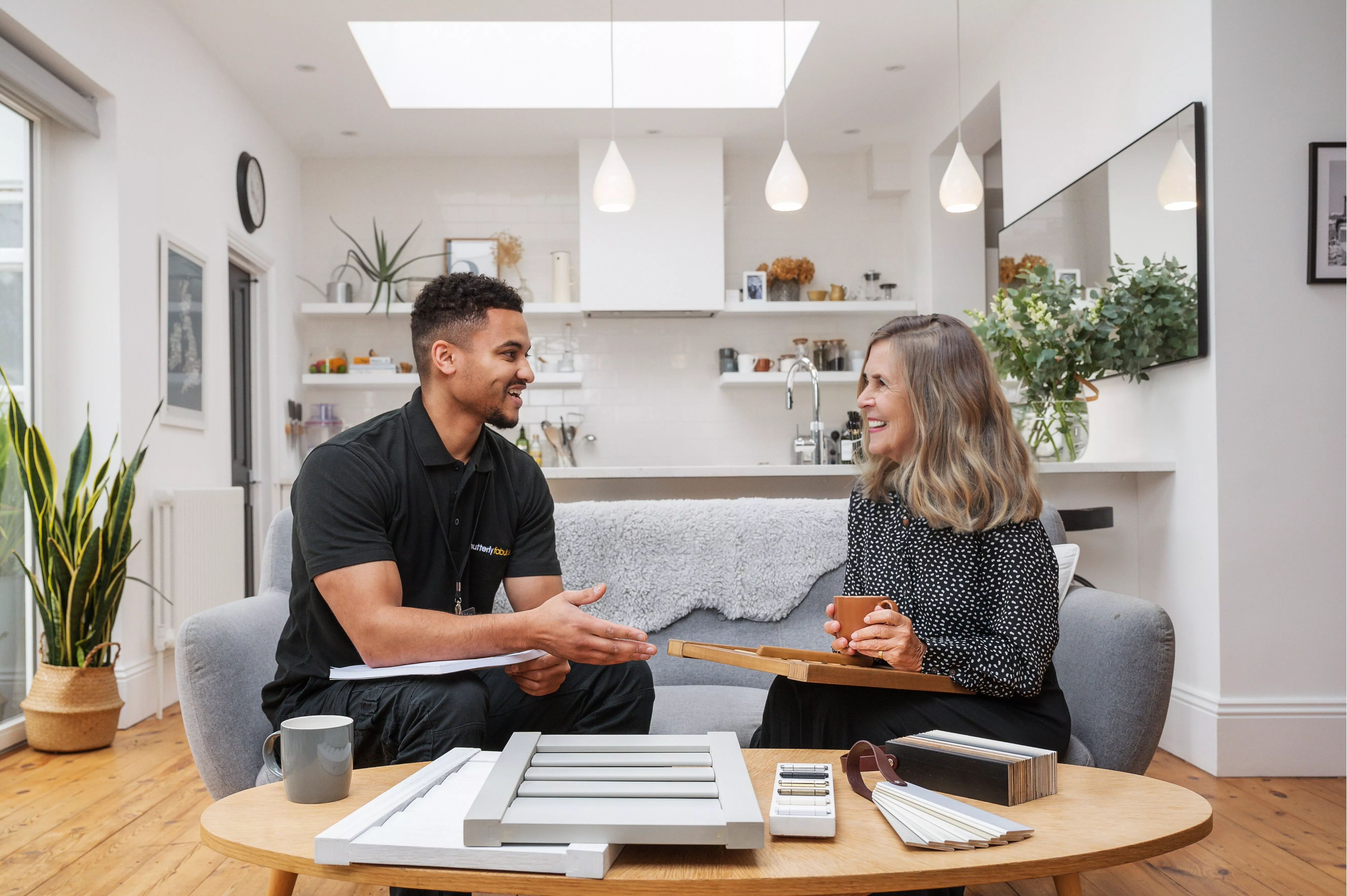Two people talking on a sofa