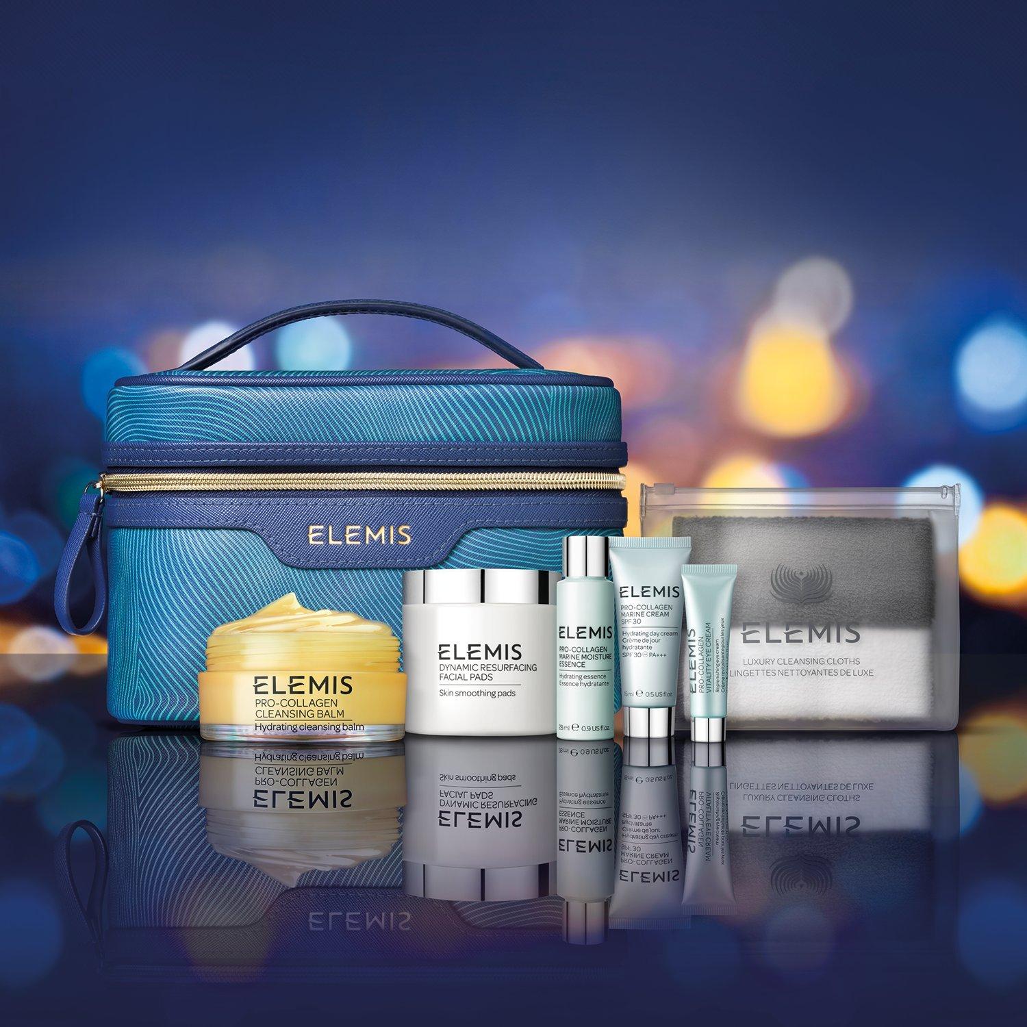 Image of a collection of gifting Elemis products on a Christmassy blue background