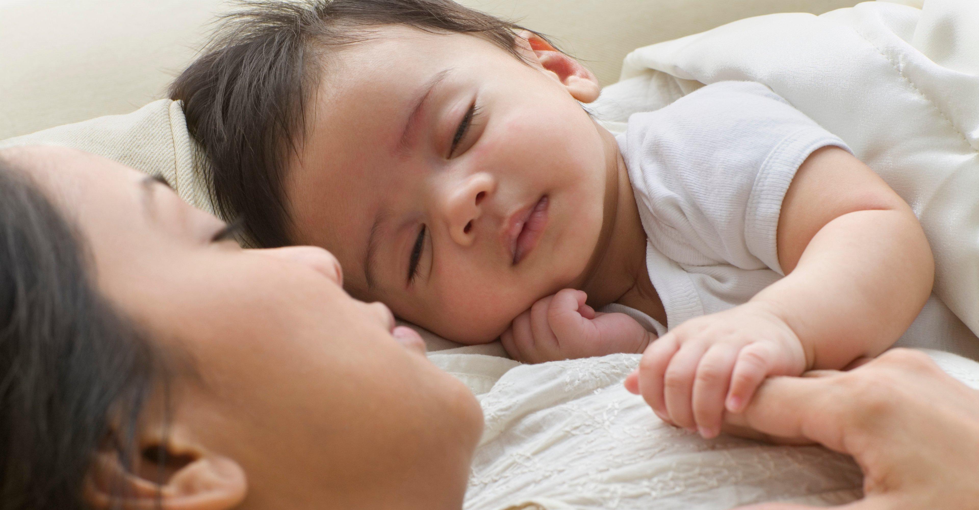 Mother and baby sleeping safely